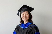 Graduate smiling in academic regalia