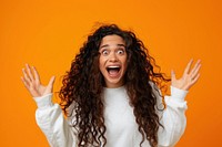 Excited young woman with long curly hair wearing white sweatshirt surprised person female.