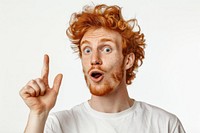 Surprised redhead man pointing up