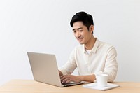 Man working on laptop smiling