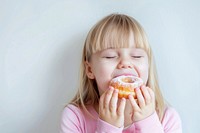 Child enjoying delicious donut