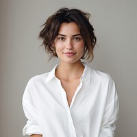 Confident woman in white shirt