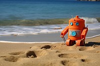 Robot toy on sandy beach