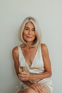 Elegant mature woman with champagne