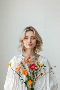 Woman holding colorful flowers