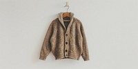 Cozy knitted brown cardigan hanging