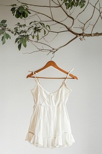 Elegant white dress hanging branch