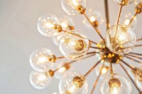 Modern chandelier with glowing bulbs