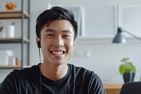 Smiling man wearing earphones indoors