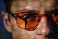 Stylish orange sunglasses reflection