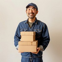 Delivery man holding cardboard boxes