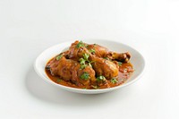 Spicy chicken curry dish garnished.