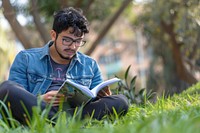 Man reading book outdoors