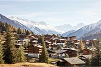 Alpine village with snowy mountains