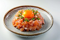 Fresh salmon tartare with egg