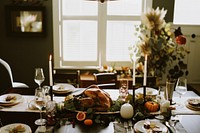 Family celebrating Thanksgiving table architecture dining table.