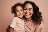 Happy mother and daughter smiling