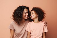 Happy mother and daughter smiling