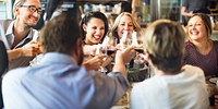 Friends celebrating with wine glasses