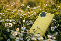 Yellow phone case mockup in meadow