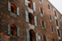 Brick building in a city, blurry background image