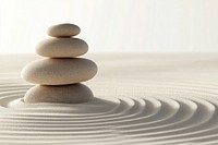 A stack of three stones on top of each other in the center background atmosphere balance.