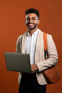 Indian engineer student happy holding a laptop photography background clothing.