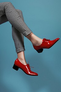 Women stocking legs up with pointy red highheels on woman footwear shoes.