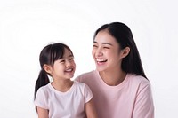 A young mixed race asian woman wearing pale pink t-shirt with her daughter laughing person people.