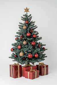 A Christmas tree with red and gold ball decoration with top stars christmas boxes gifts.