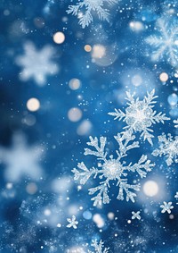 A blue background with white snowflakes and bokeh lights astronomy outdoors nature.