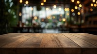 Empty wooden table top with a blurred bokeh architecture furniture tabletop.