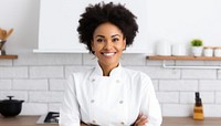 Smiling chef in modern kitchen