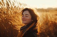 Side view photo of asian woman smiles with her eyes closed portrait autumn sunset.