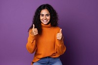 Smiling woman with thumbs up