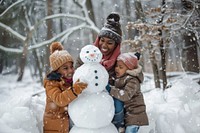 Black mother and black children outdoors snowman nature.