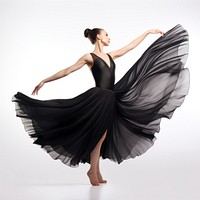 Beautiful ballerina in a black silk skirt dancing woman recreation.