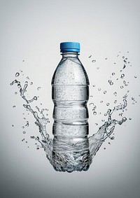 A water bottle surrounding with water splash around the transparent water bottle with blue lid minimalist background beverage.