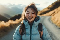 Happy young woman wearing a down jacket laughing photo girl.