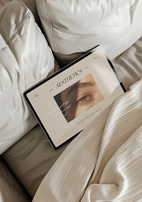 Elegant tablet mockup on cozy bed