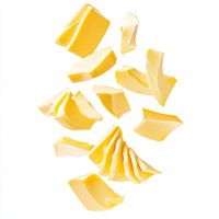 Exploding butter slices background white food.