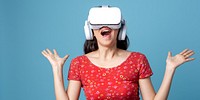 Excited woman wearing VR headset