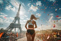 Runner celebrating near Eiffel Tower