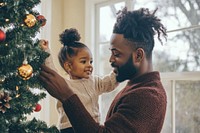 Decorating christmas tree daughter father family.