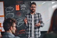 Creative hipster man presentation whiteboard office.