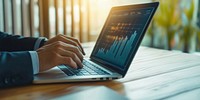 Businessman using a laptop analytics business screen.