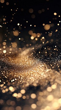 Shimmering golden particles background celebration glittering.