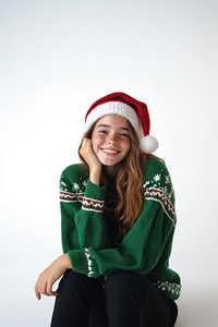 South girl in a green sweater and Christmas hat winks photography christmas clothing.