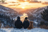 Couple and dog sitting snow mountains outdoors.