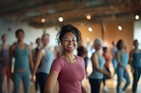 A smiling asian black woman dancing at the gym lifestyle active happy.